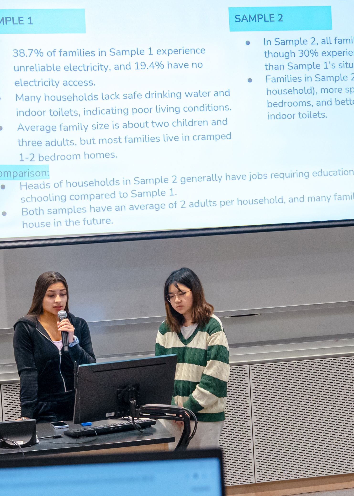 two students giving a presentation